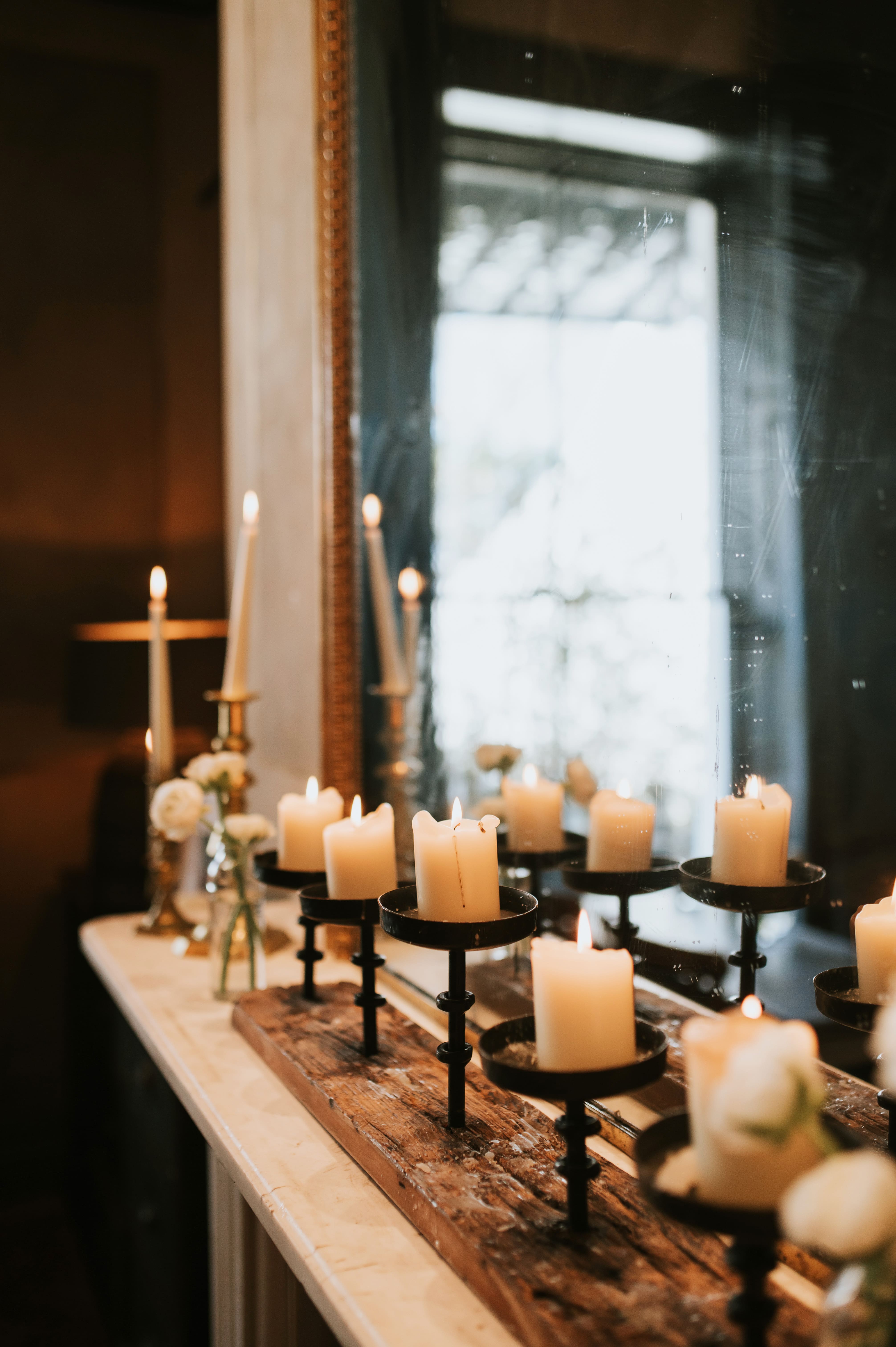 wedding detail of candles on a mantle at no.131 Cheltenham